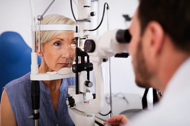 female patient receiving eye exam