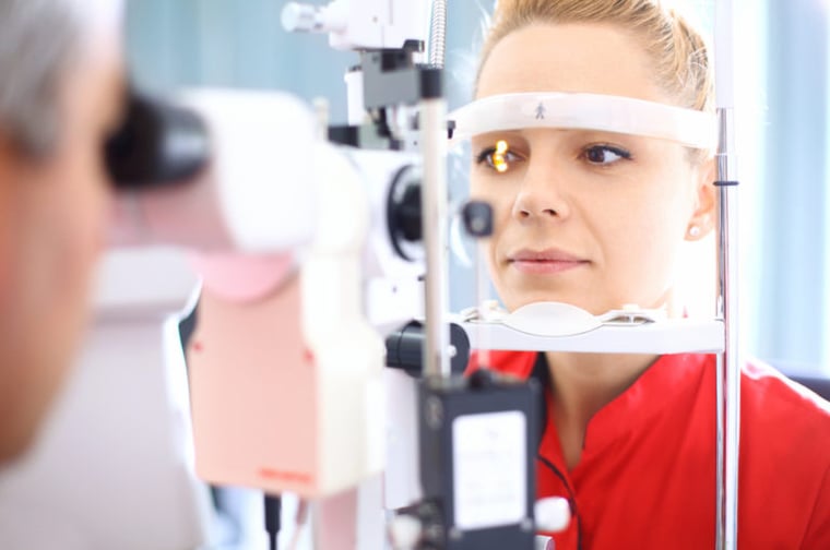 female patience receiving an eye exam