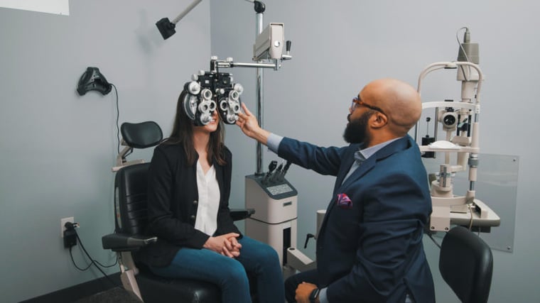 Dr. Darryl Glover, OD performing an eye exam