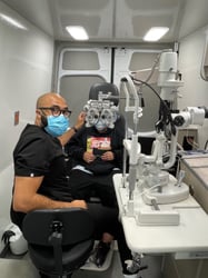 Dr. Darryl Glover, OD performing an eye exam on a patient
