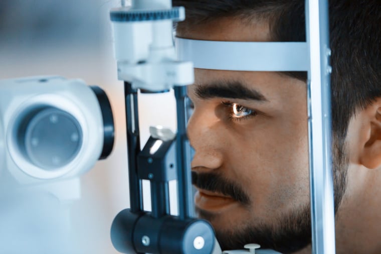 male patient receiving eye exam
